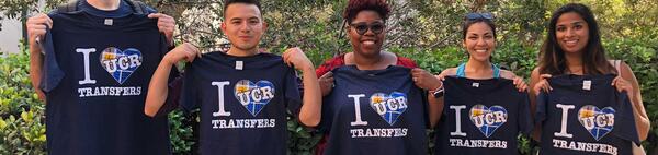 transfer students holding I heart UCR t-shirts