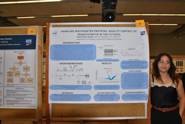 Student stands next to poster on display at MSRIP Symposium